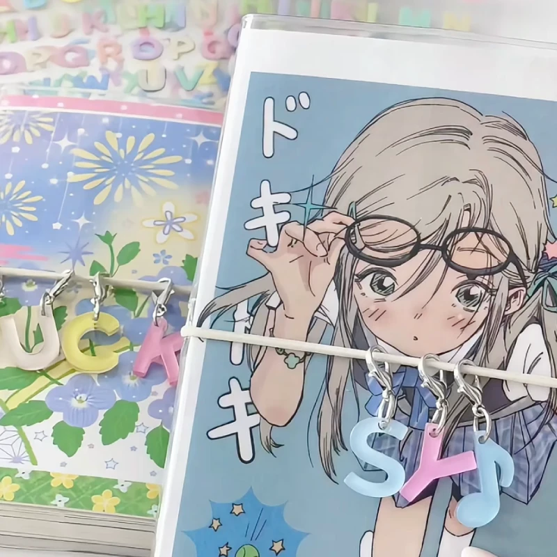 acrylic initial notebook charm attached to a notebook